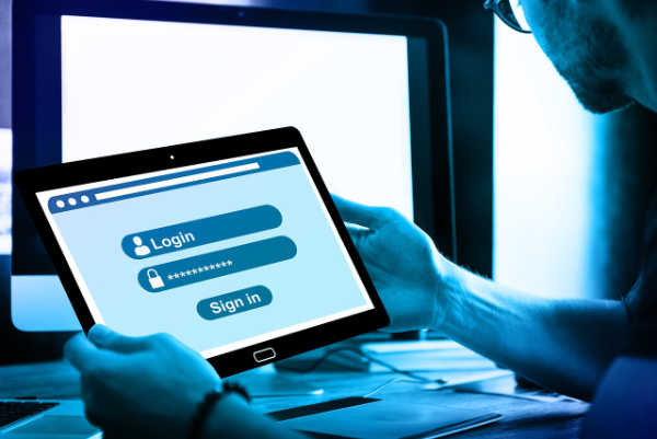 Man Logging into Computer