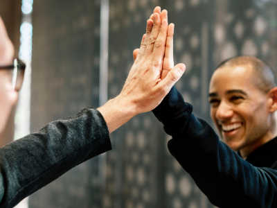 two men giving each other a high-five